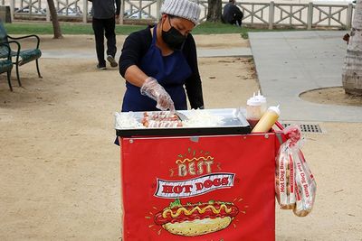 a woman in a hot dog stand