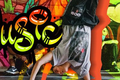 A woman showcasing impressive breakdancing moves against a vibrant backdrop adorned with graffiti art.