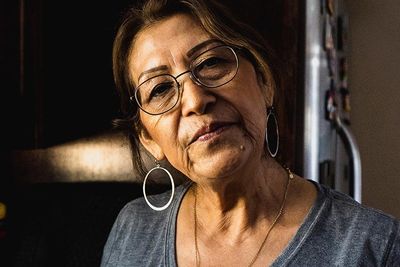 hispanic adult woman with hoop earrings