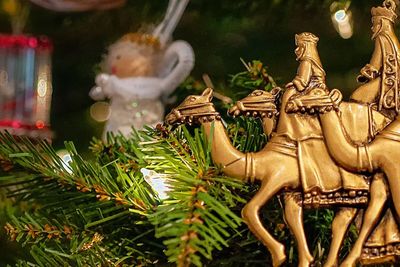 the three wise men ornament hanging from christmas tree