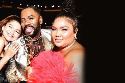 Actors Zendaya and Colman Domingo and singer Lizzo stand close to eachother posing for a picture