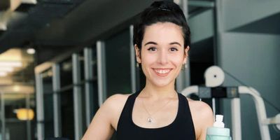 Woman smiling at the gym.