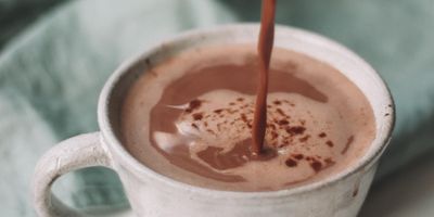 chocolate pouring in white mug