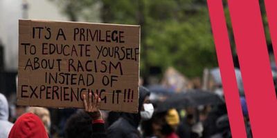 Sign that says "It's a privilege to educate yourself about racism instead of experiencing it".