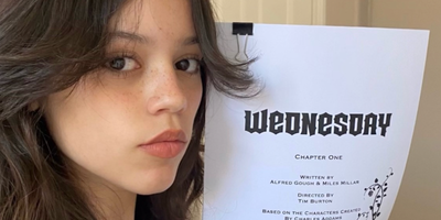 Jenna Ortega posing with the script for her role as Wednesday Addams in new netflix show 