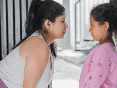 older woman looking at child