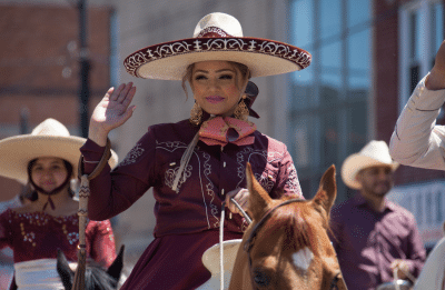 woman smiling dressed in traditional mexican clothes
