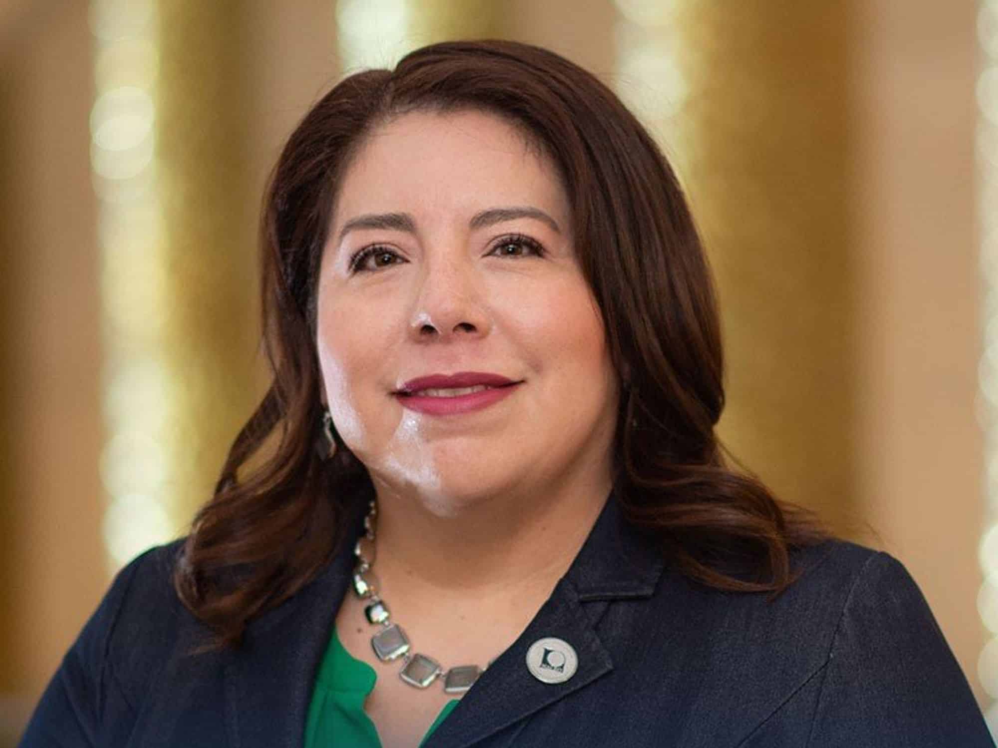 professional headshot of latina woman smiling