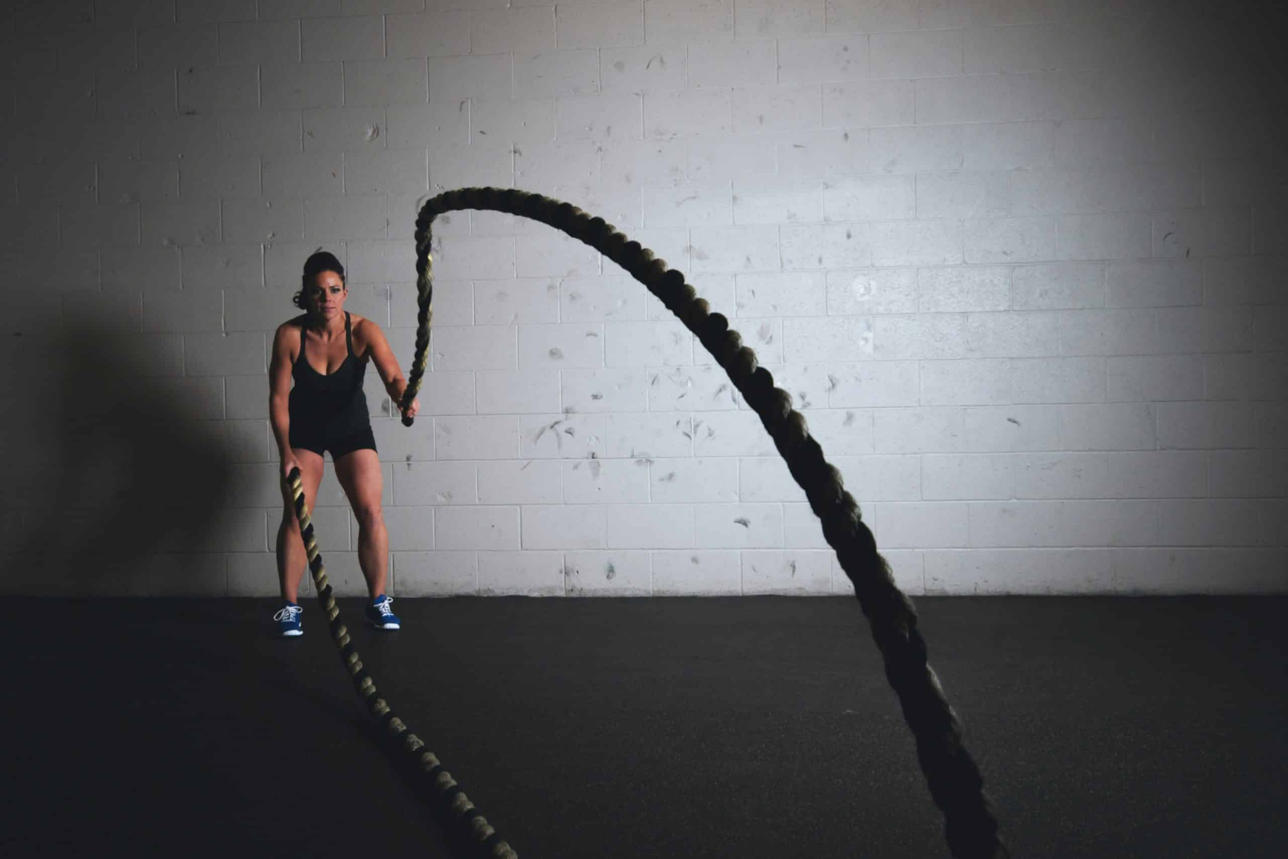 woman working out with ropes