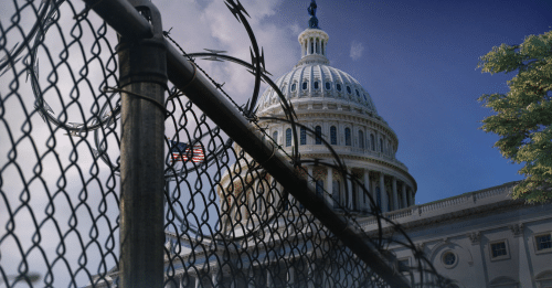 capitol building surrounded by fences